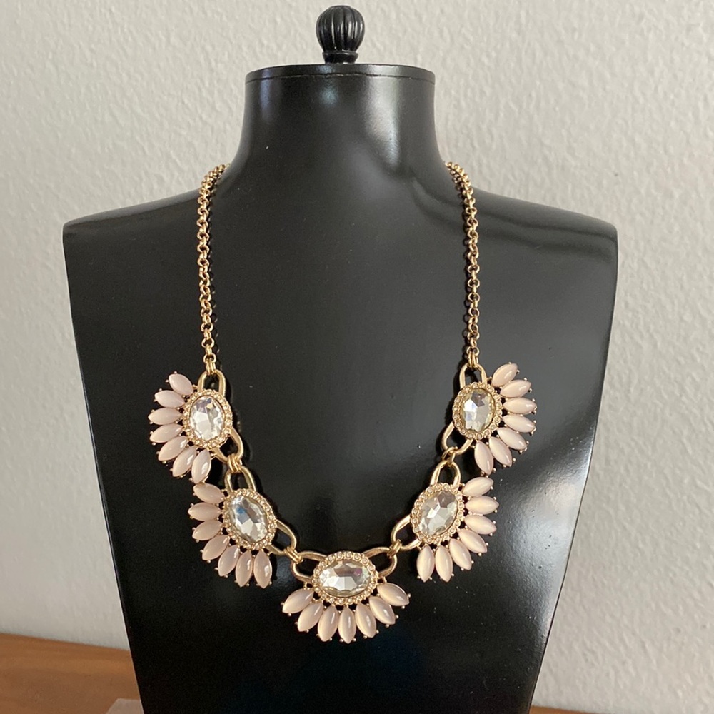 Gold tone necklace with pink faceted beads